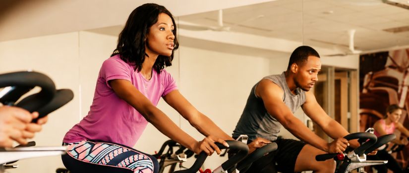 people on exercise bikes