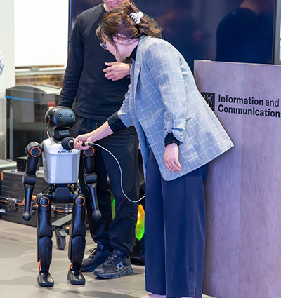 Fan Yang and a robot