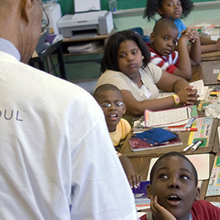 teacher facing class viewed from behind