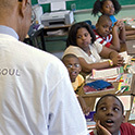 group of students looking up at teacher