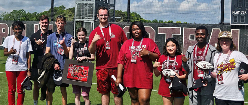 CarolinaLIFE Students on the grass of Williams-Brice Stadium