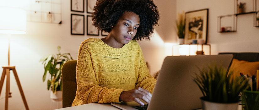 African American woman working on a laptop