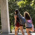 Two women walking outside