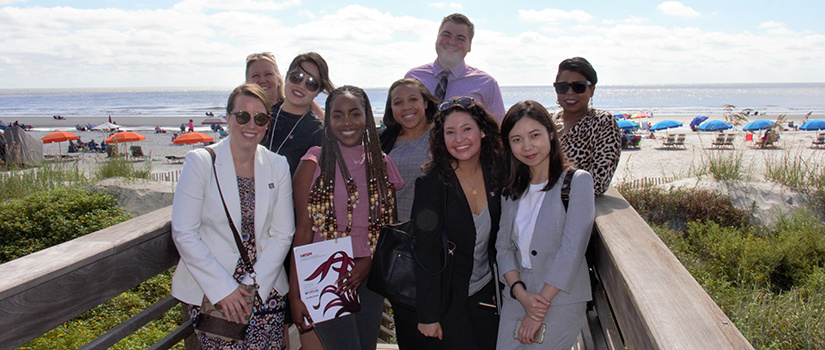 HRSM professor Scott Smith speaks to a group of students while touring Walt Disney World.