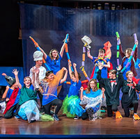 Kids on stage at the opera experience summer camp.